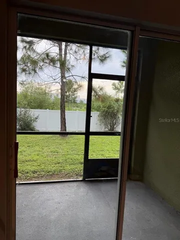 a view of large window with an outdoor space