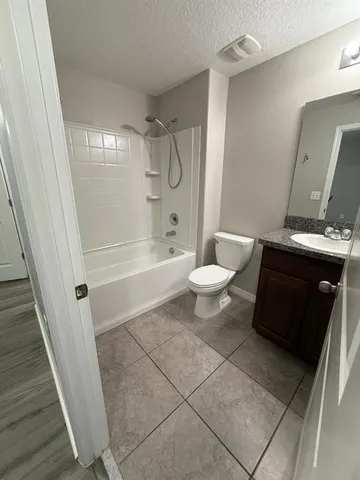 a bathroom with a toilet a sink and a bathtub