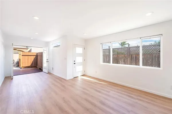 a view of a room with wooden floor