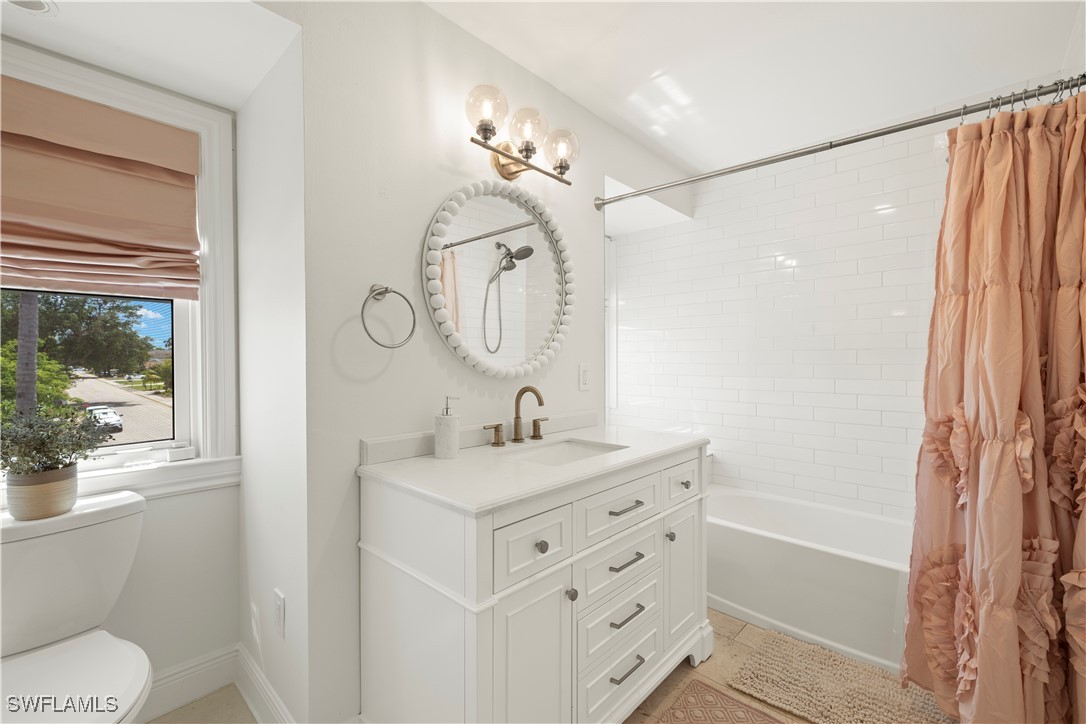 8451 Casa Del Rio Lane Fort Myers, FL 33919 - Photo 35 of 50 a bathroom with a sink a toilet and shower