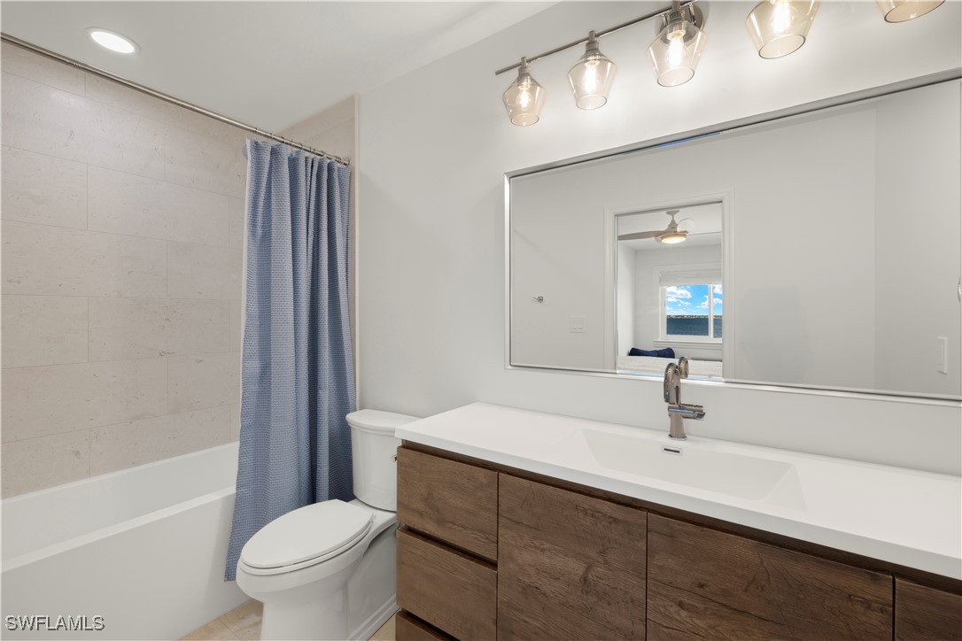 8451 Casa Del Rio Lane Fort Myers, FL 33919 - Photo 39 of 50 a bathroom with a sink a toilet and shower