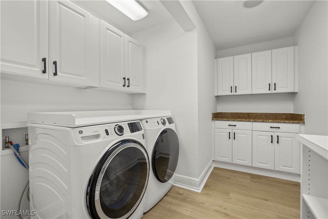 8451 Casa Del Rio Lane Fort Myers, FL 33919 - Photo 41 of 50 a utility room with sink dryer and washer