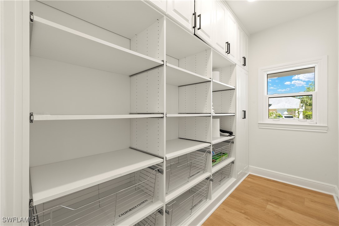 8451 Casa Del Rio Lane Fort Myers, FL 33919 - Photo 42 of 50 a view of walk in closet with empty racks