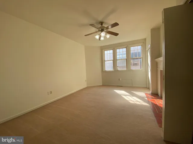 a view of an empty room with a window