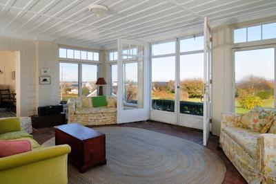 108 Shore Road Chatham, MA 02633 - Photo 15 of 31 a living room with furniture and a large window