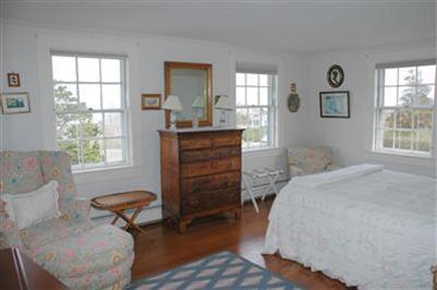 108 Shore Road Chatham, MA 02633 - Photo 26 of 31 a bedroom with a bed and windows