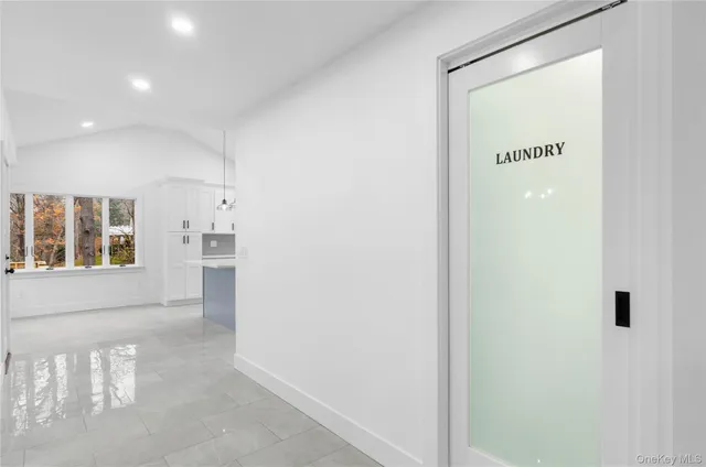 a view of a hallway with windows