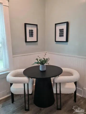 a bathroom with a toilet a sink and shower