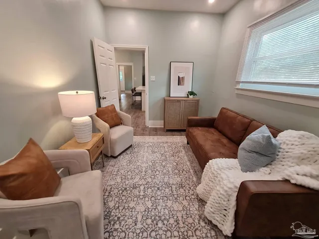 a living room with furniture and a window