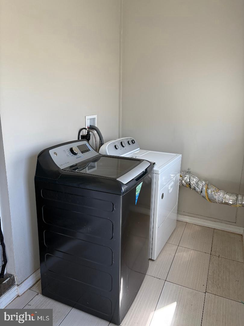 917 High Street Bethlehem, PA 18018 - Photo 7 of 19 Modern laundry space with sleek appliances.