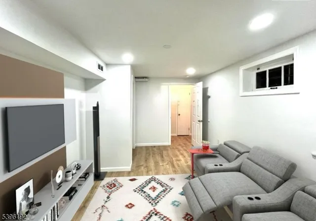 a living room with a couch and a flat screen tv