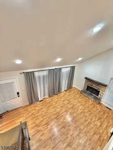 a white refrigerator with white walls