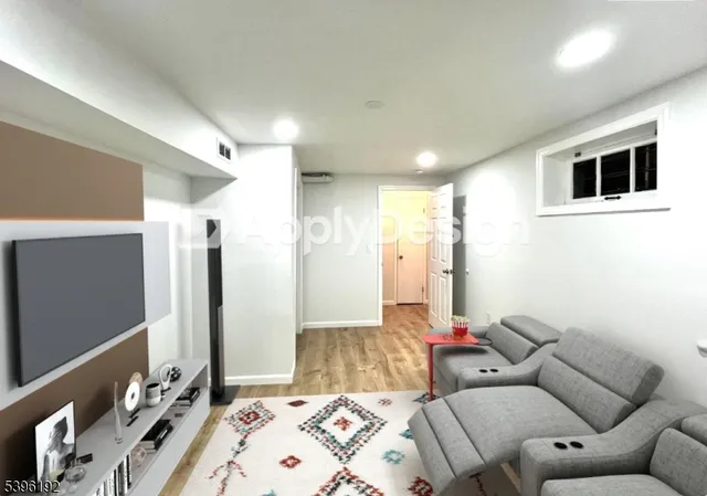 a living room with a couch and a flat screen tv