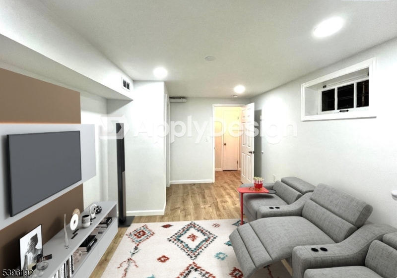 118 Bluebird Drive, Unit 3A Hillsborough, NJ 08844 - Photo 5 of 29 a living room with a couch and a flat screen tv