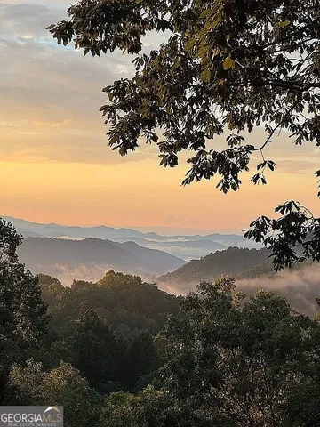 a view of mountain with lake view