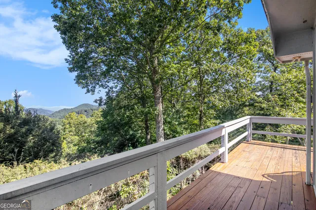 a view of balcony with wooden floor