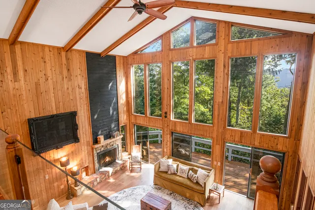 a living room filled with furniture and a window