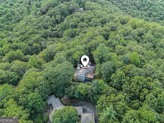 a view of a balcony with a forest