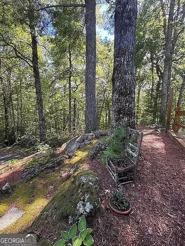 a view of a brick house with a yard