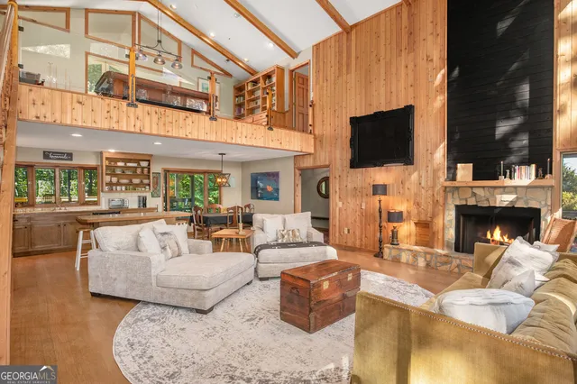 a living room with fireplace furniture and a flat screen tv