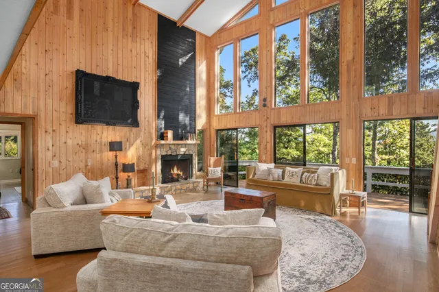 a living room with fireplace furniture and a flat screen tv
