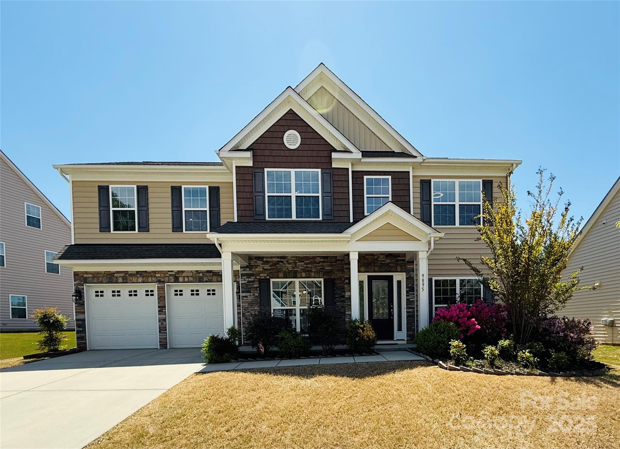 a front view of a house with a yard