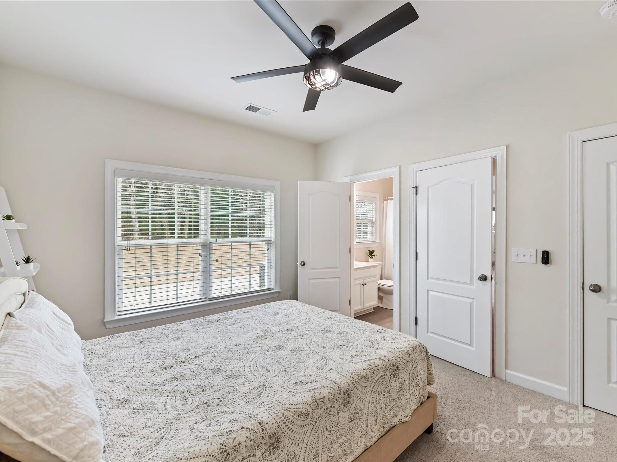 9895 Travertine Trail Davidson, NC 28036 - Photo 19 of 48 a bedroom with a bed and a window