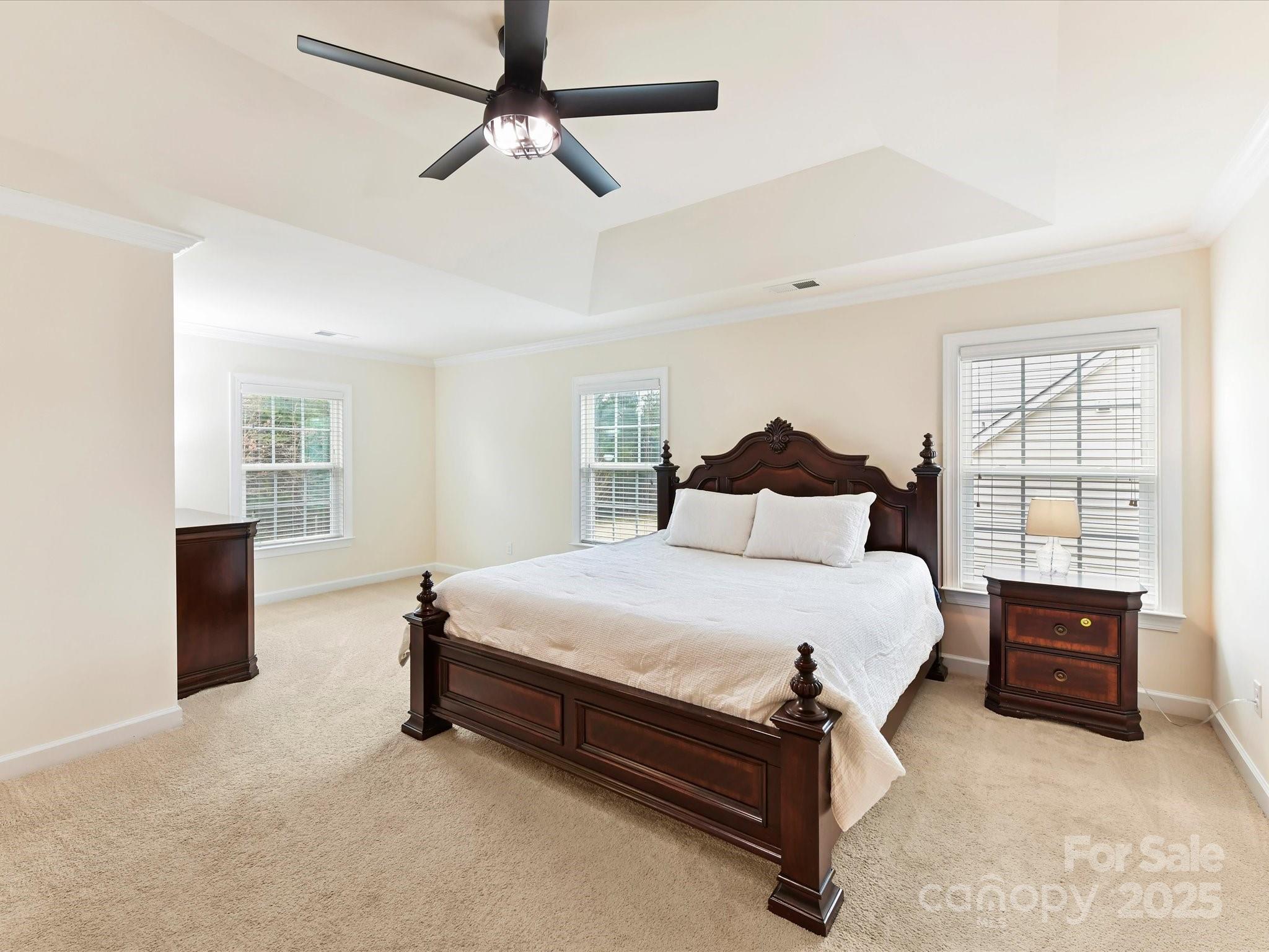 9895 Travertine Trail Davidson, NC 28036 - Photo 25 of 48 a bedroom with a bed and a cabinets