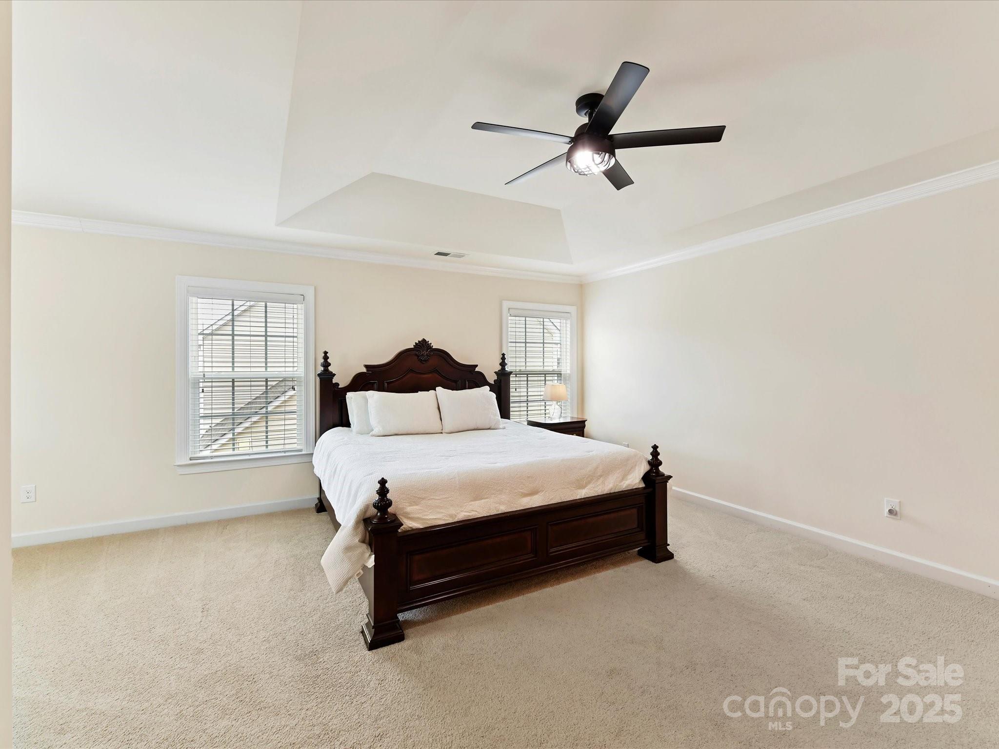 9895 Travertine Trail Davidson, NC 28036 - Photo 27 of 48 a bedroom with a bed and window