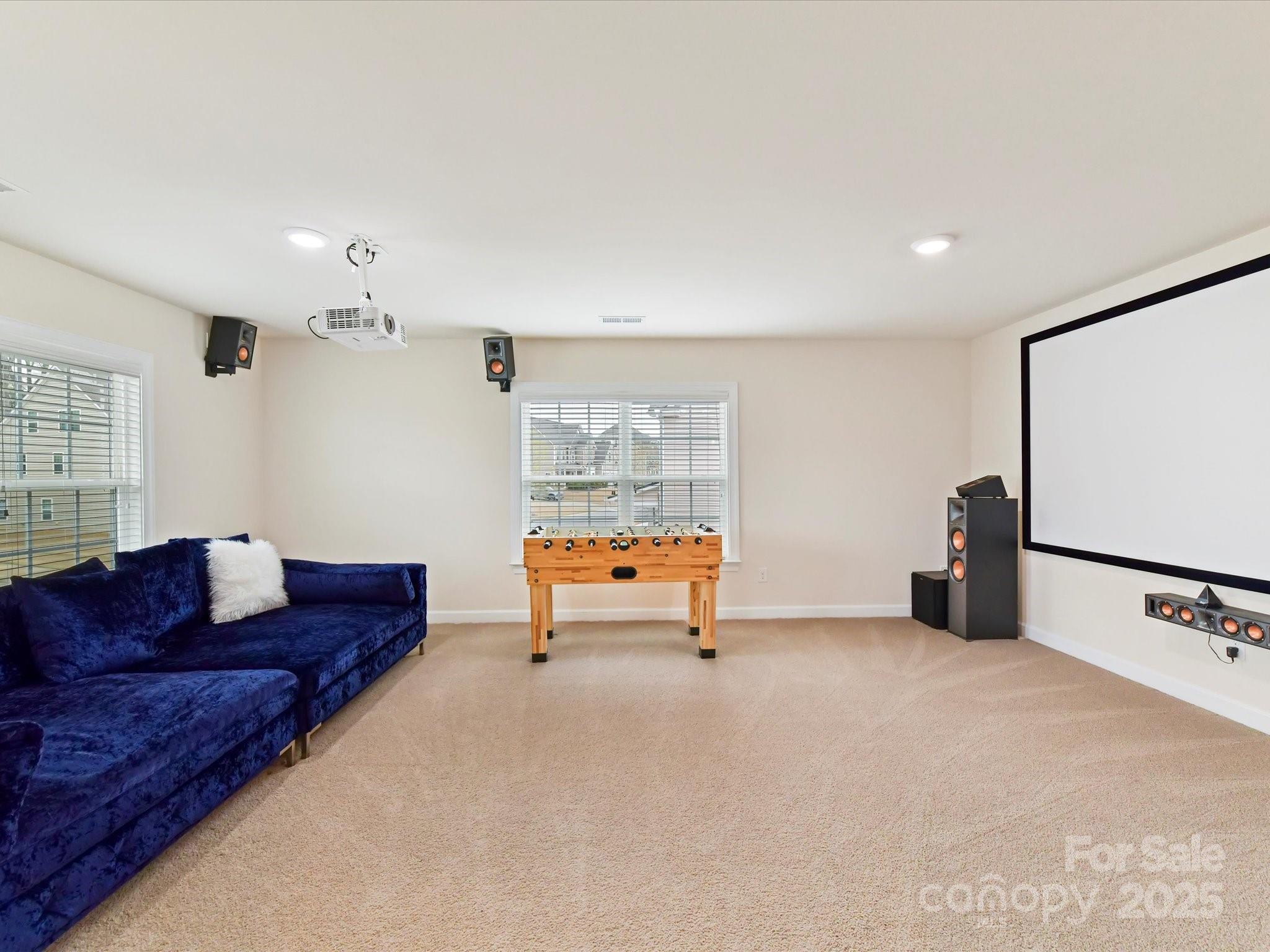 9895 Travertine Trail Davidson, NC 28036 - Photo 37 of 48 a living room with furniture and a flat screen tv