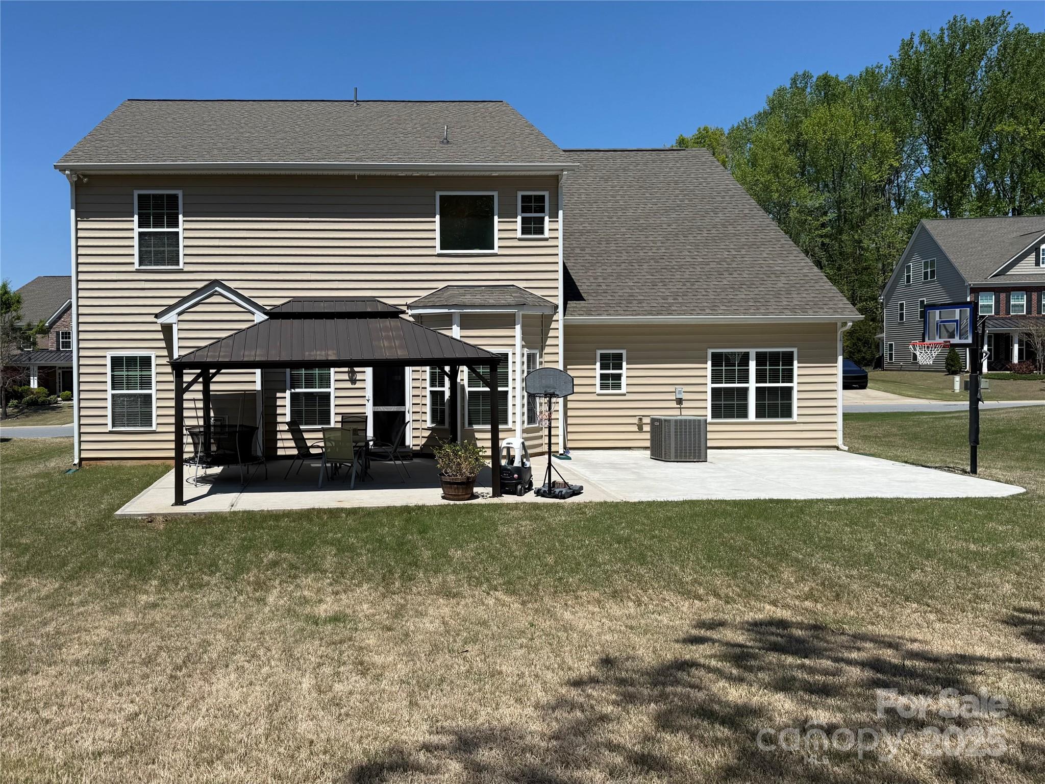 9895 Travertine Trail Davidson, NC 28036 - Photo 39 of 48 a front view of a house with a yard