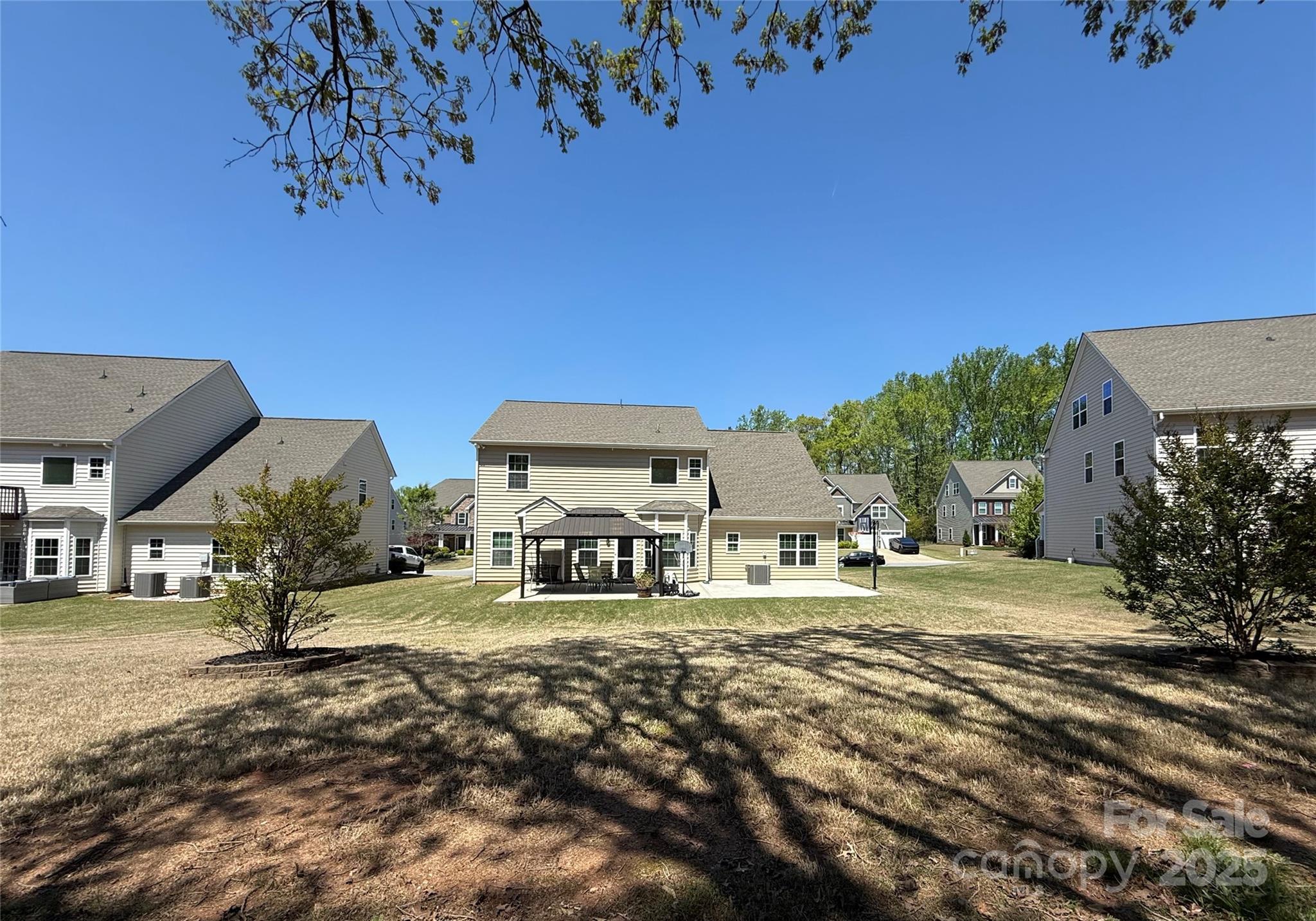 9895 Travertine Trail Davidson, NC 28036 - Photo 40 of 48 a view of a house with a yard