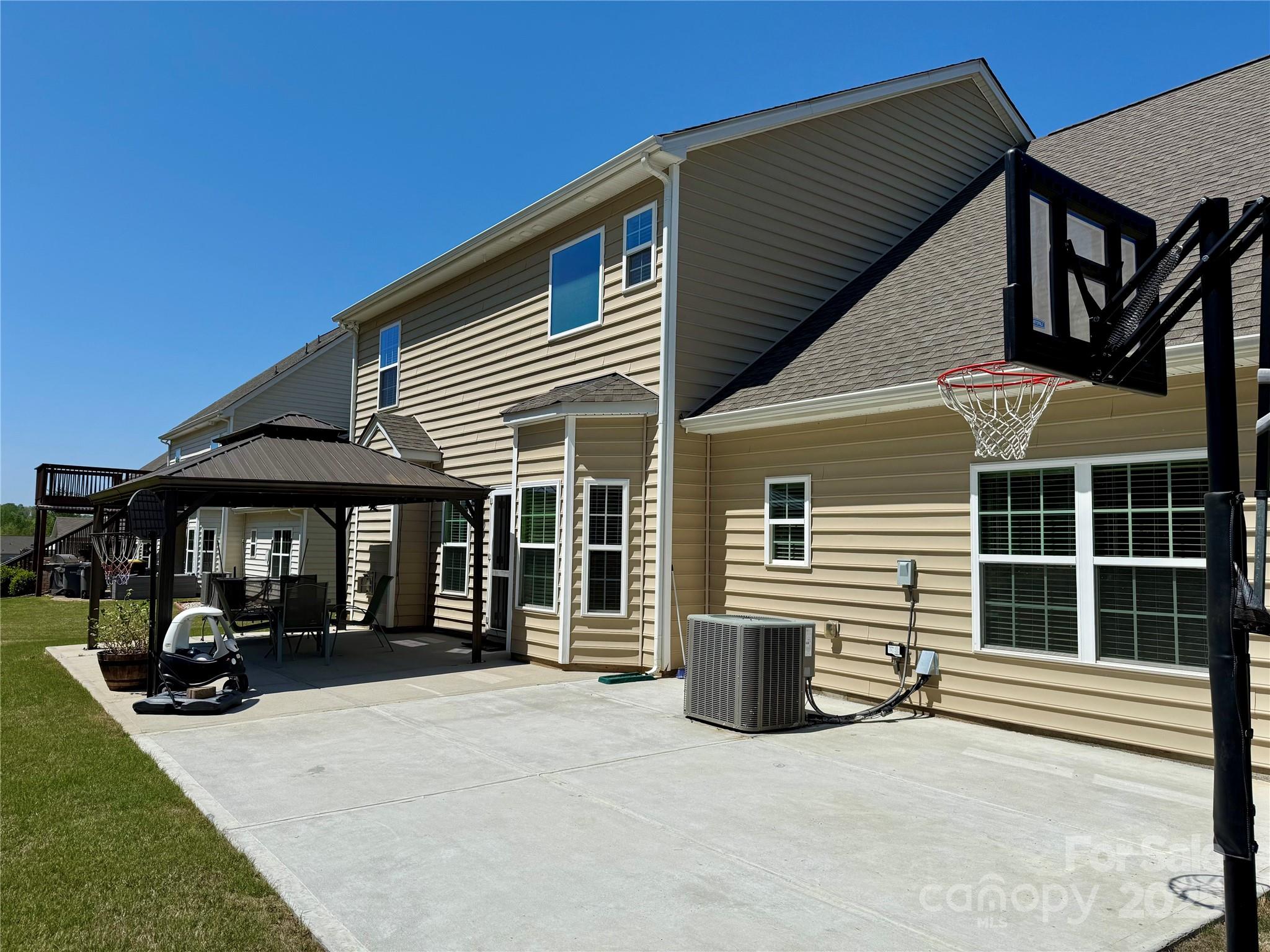 9895 Travertine Trail Davidson, NC 28036 - Photo 43 of 48 a view of a house with a patio