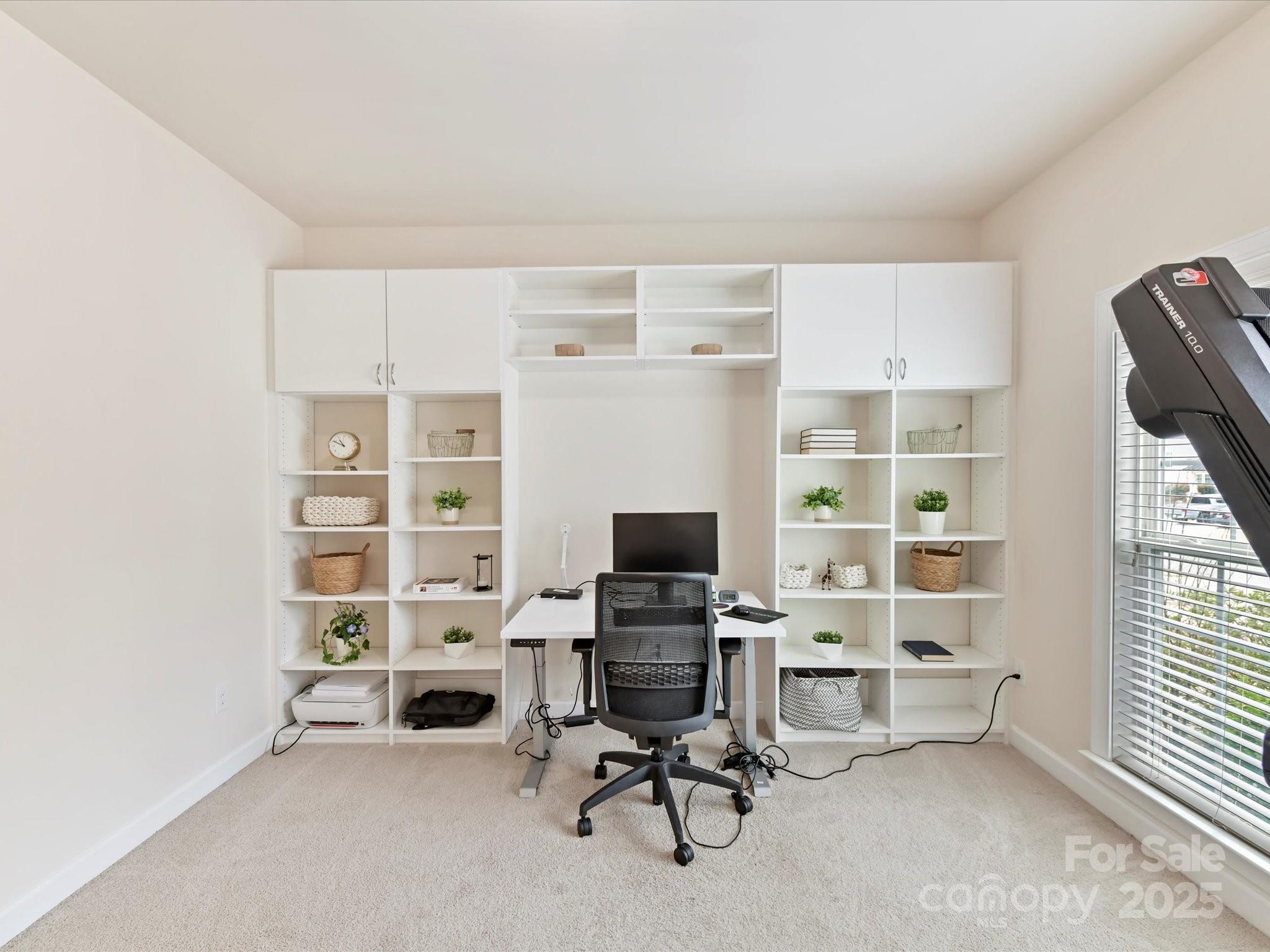 9895 Travertine Trail Davidson, NC 28036 - Photo 7 of 48 a view of a workspace with furniture and a window
