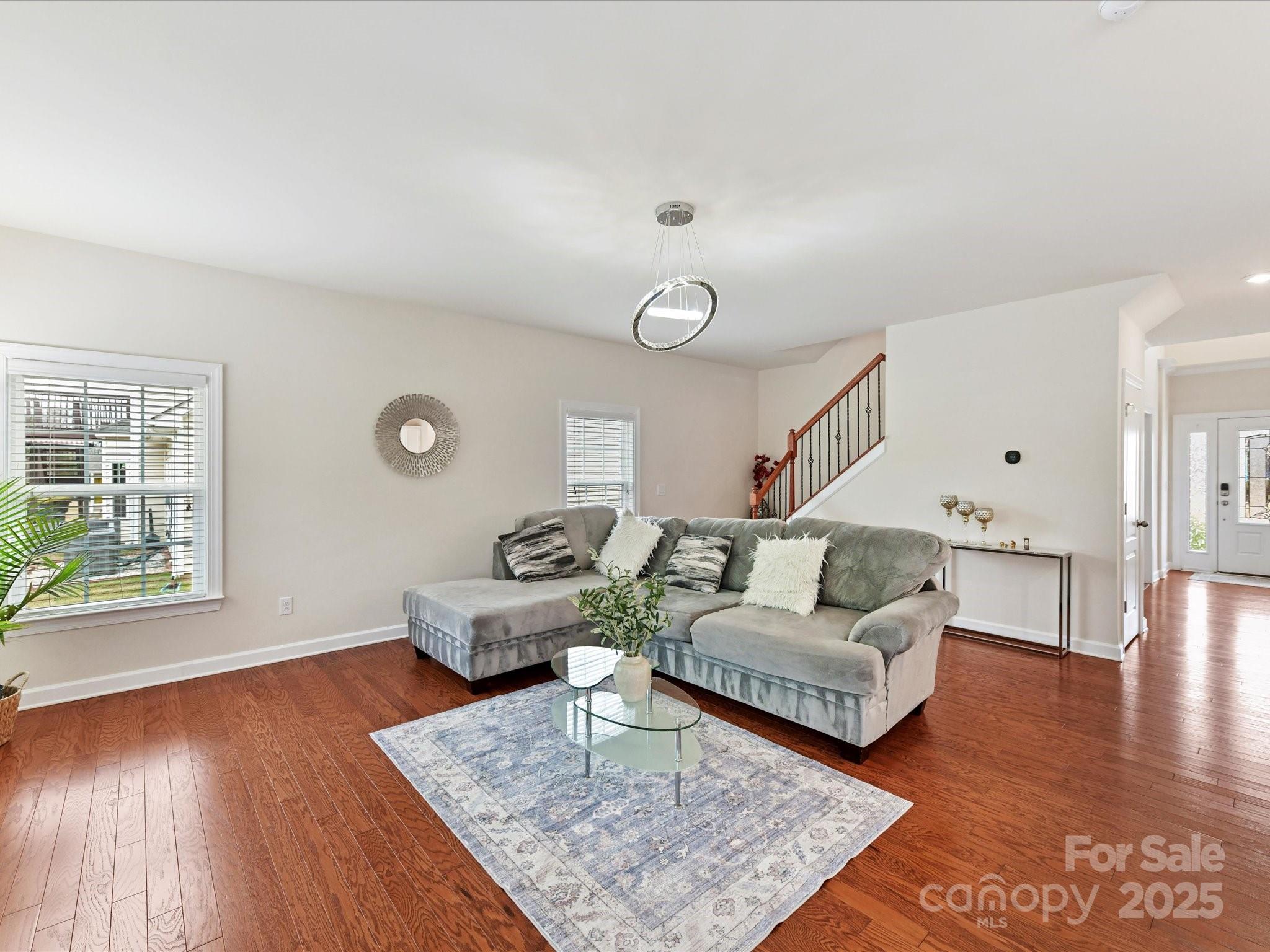 9895 Travertine Trail Davidson, NC 28036 - Photo 10 of 48 a living room with furniture and wooden floor