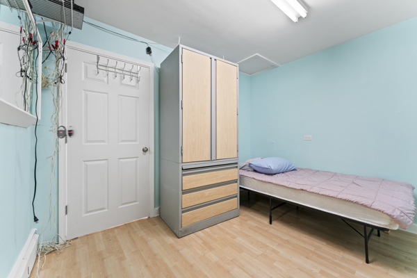 5322 West Addison Street Chicago, IL 60641 - Photo 12 of 21 a bedroom with a bed and a dresser