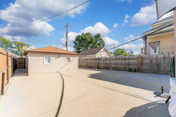5322 West Addison Street Chicago, IL 60641 - Photo 20 of 21 a view of backyard with wooden fence