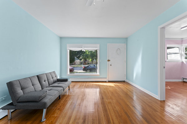 5322 West Addison Street Chicago, IL 60641 - Photo 5 of 21 a living room with a couch and a window