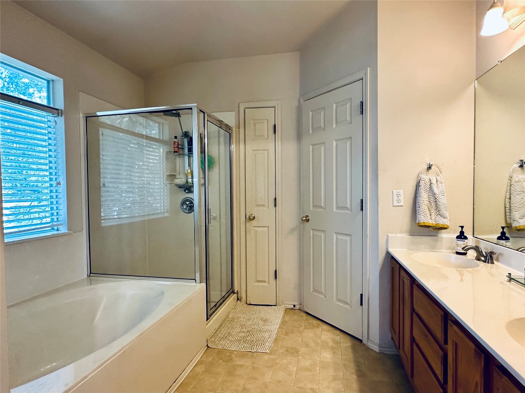 8300 Alvin High Lane Austin, TX 78729 - Photo 11 of 21 a bathroom with a tub sink and mirror
