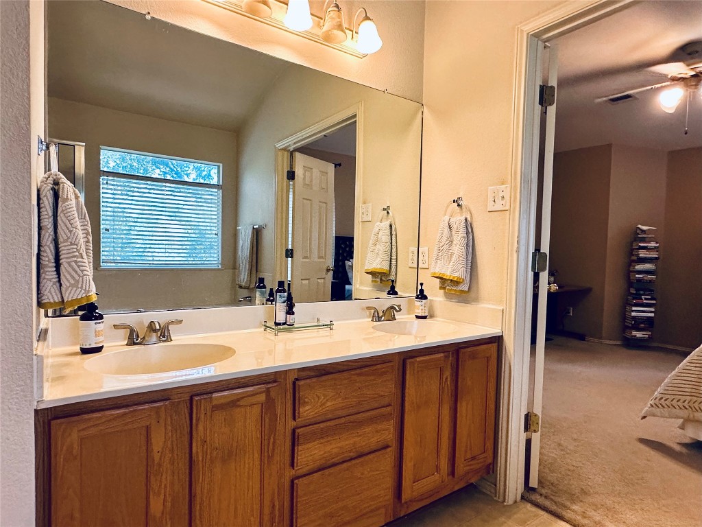 8300 Alvin High Lane Austin, TX 78729 - Photo 13 of 21 a bathroom with a double vanity sink and a mirror