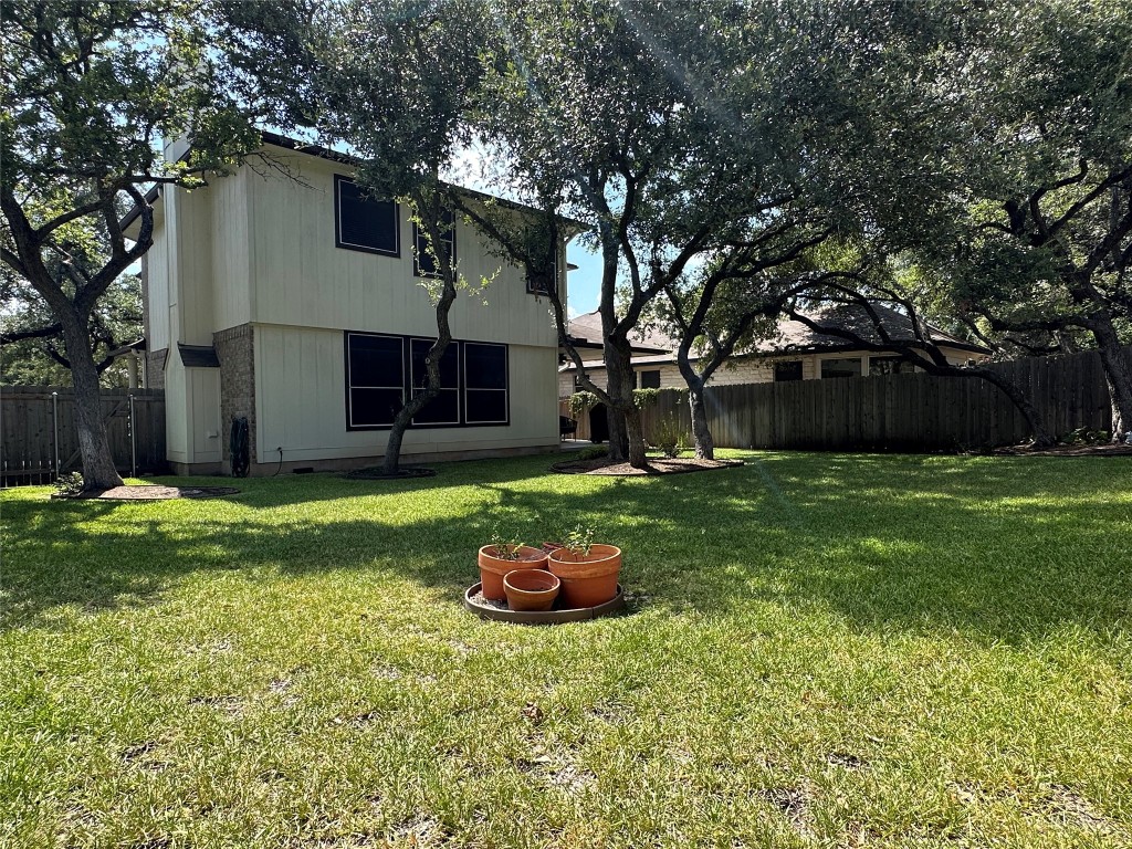 8300 Alvin High Lane Austin, TX 78729 - Photo 20 of 21 a front view of a house with garden