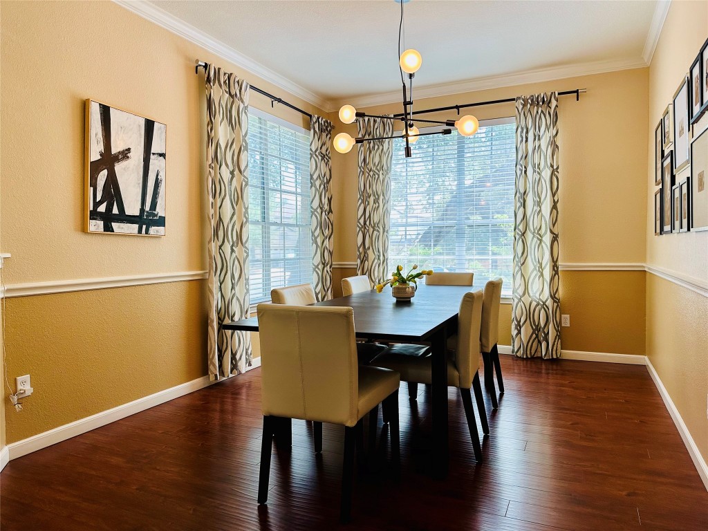 8300 Alvin High Lane Austin, TX 78729 - Photo 2 of 21 a view of a dining room with furniture window and wooden floor