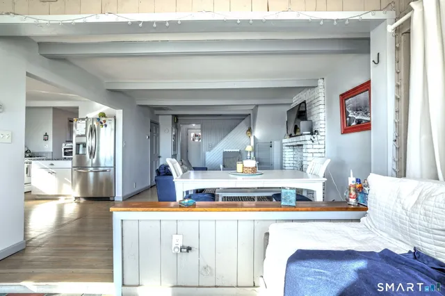 a view of kitchen with furniture and wooden floor