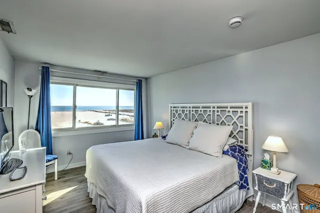 a bedroom with a large bed and a window