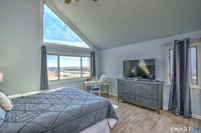 a bedroom with a bed and furniture