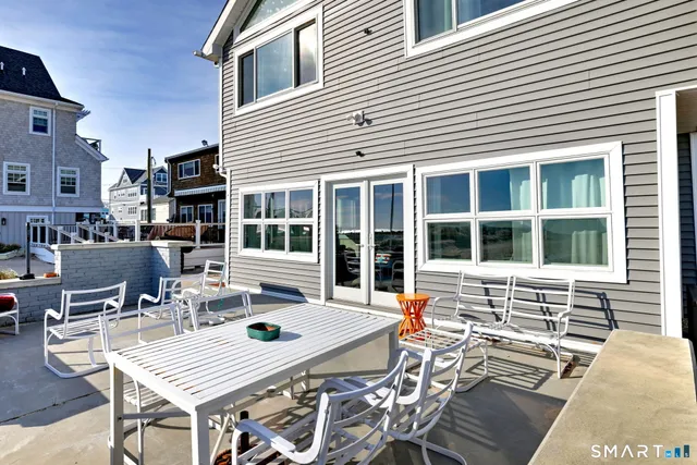 a view of a dinning table and chairs in the patio
