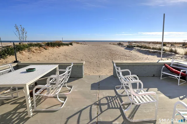 an outdoor seating area with furniture