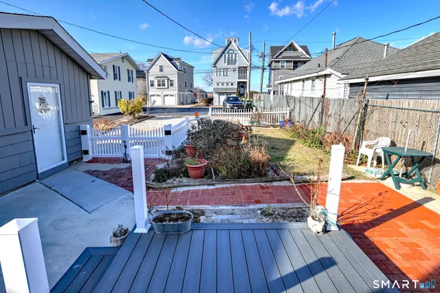 a view of living room kitchen with furniture and wooden floor