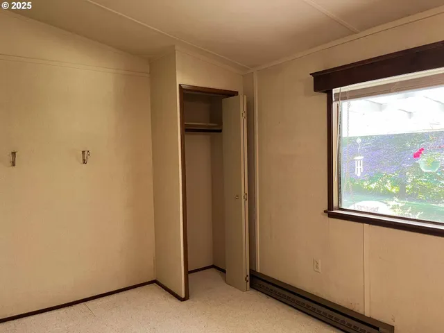 a kitchen with electric appliances and a window