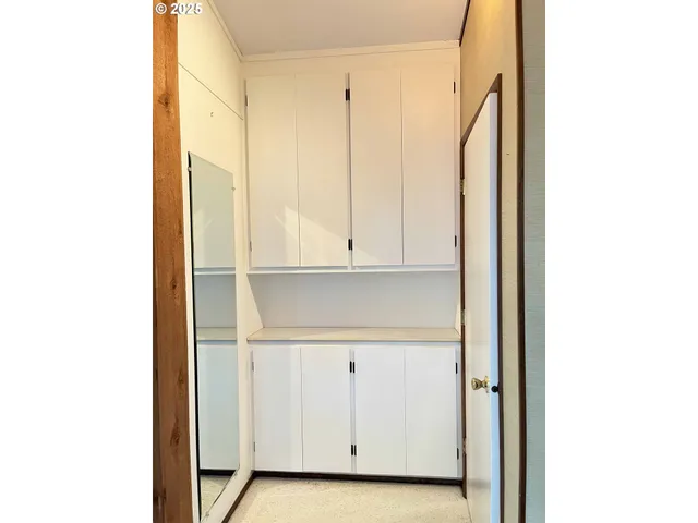 a kitchen with stainless steel appliances a sink a stove and a microwave